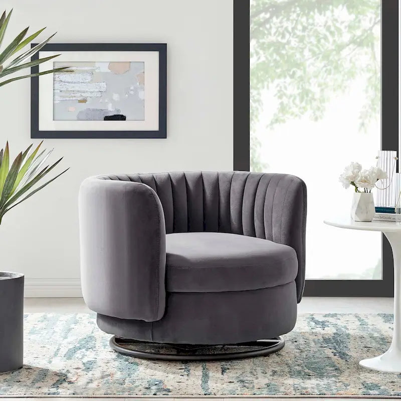 Fauteuil pivotant Embrace en velours performant capitonné